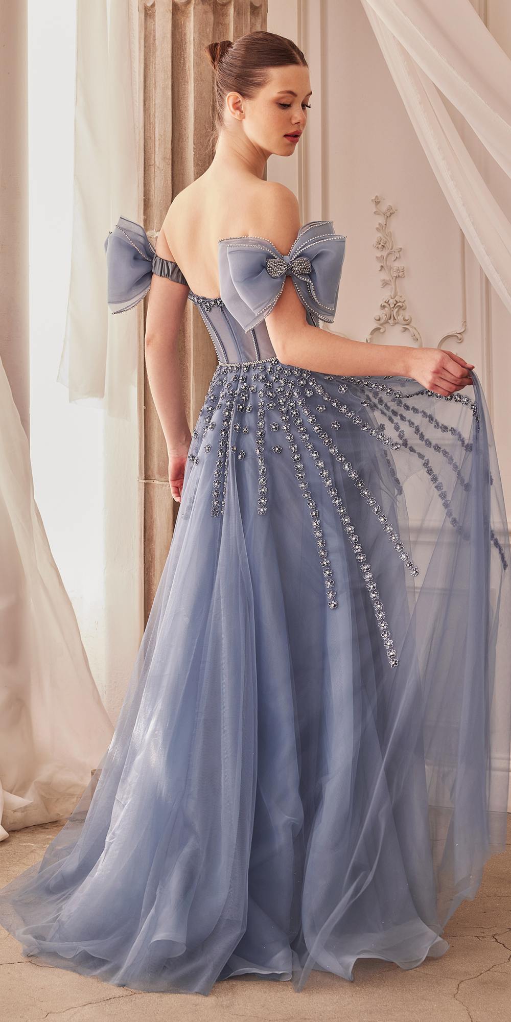 Midnight blue strapless beaded gown with bow arm bands and decorative corset back detail.