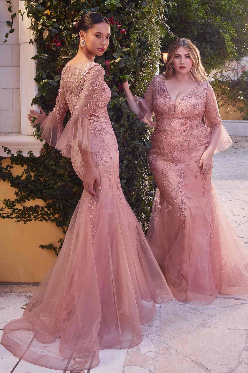 Rose fitted lace mermaid gown with V-neck and sheer trumpet sleeves, flared skirt.
