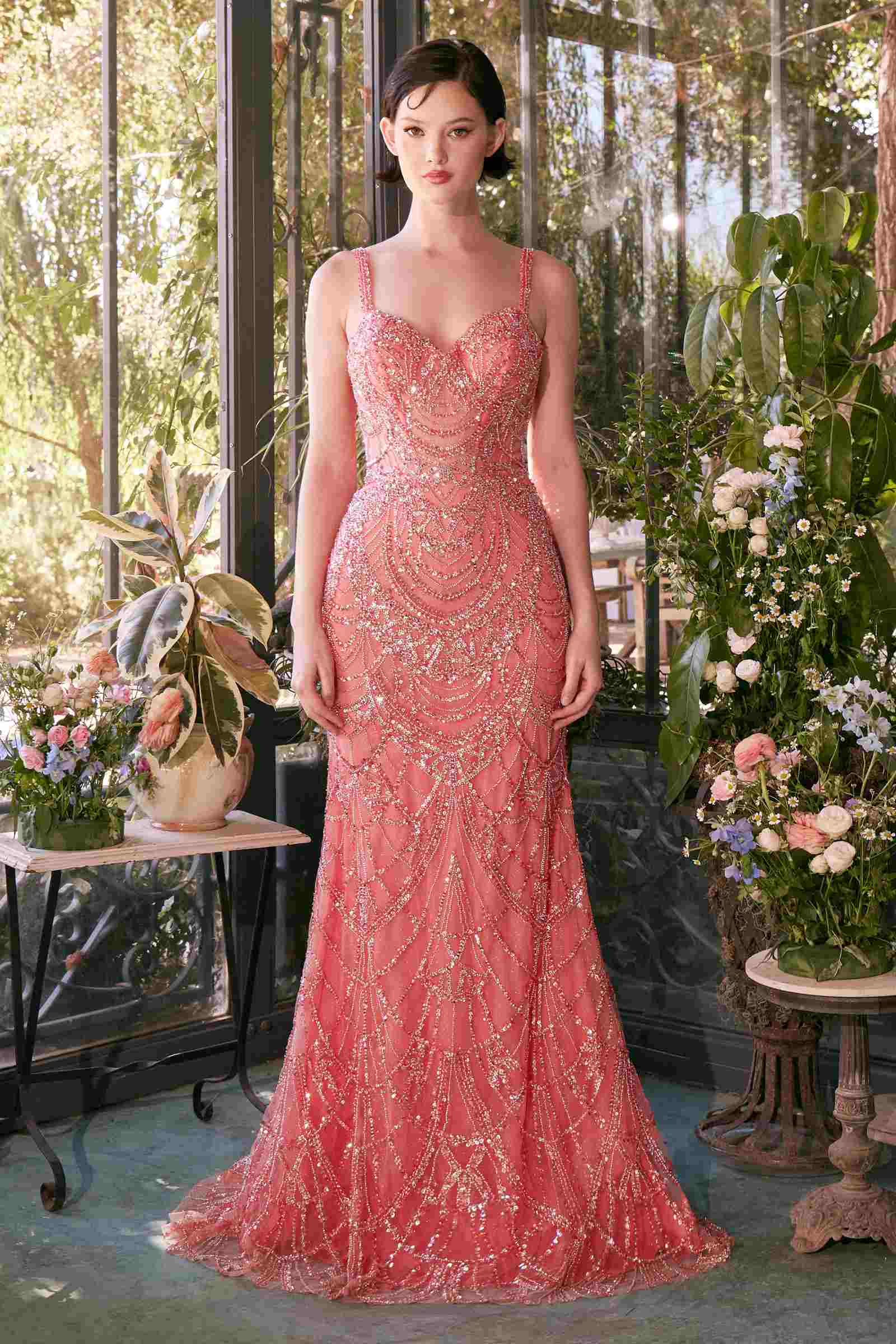 Rose-pink fitted beaded evening gown with thin straps and scalloped sparkle texture