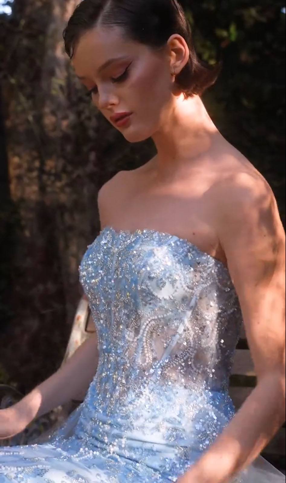 Light blue strapless sequin bodice with layered tulle overskirt