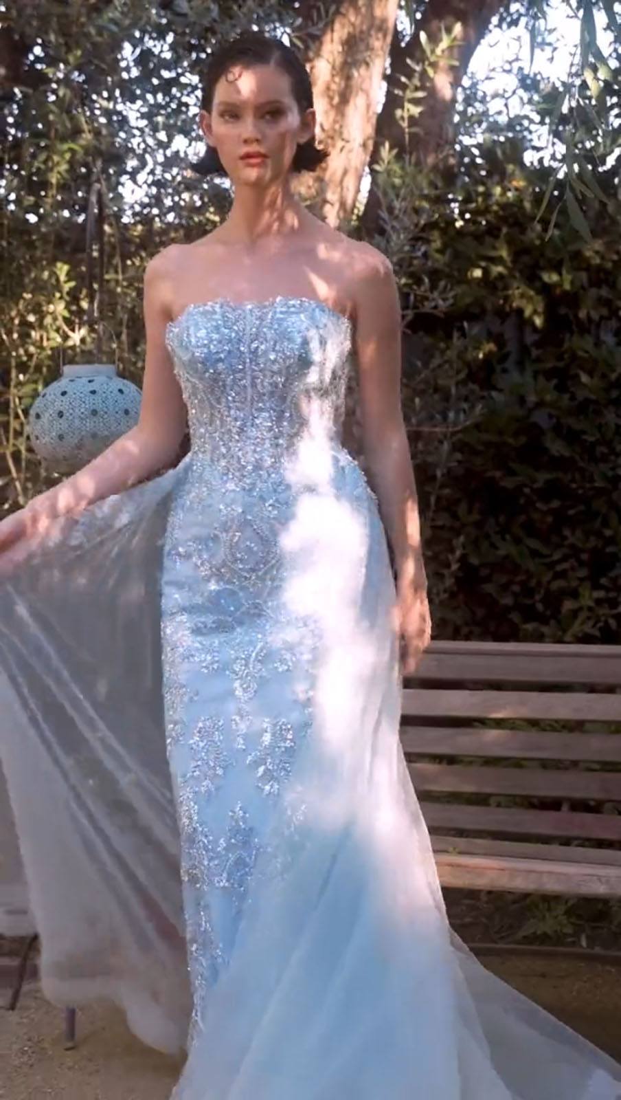 Light blue strapless sequin gown with flowing layered tulle skirt