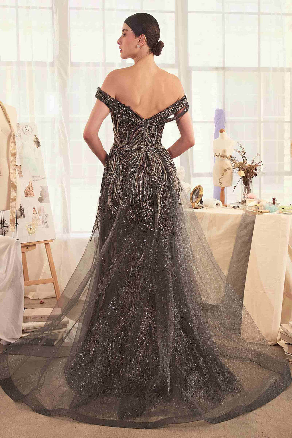 Dark silver off-shoulder beaded gown with draped overskirt, back view
