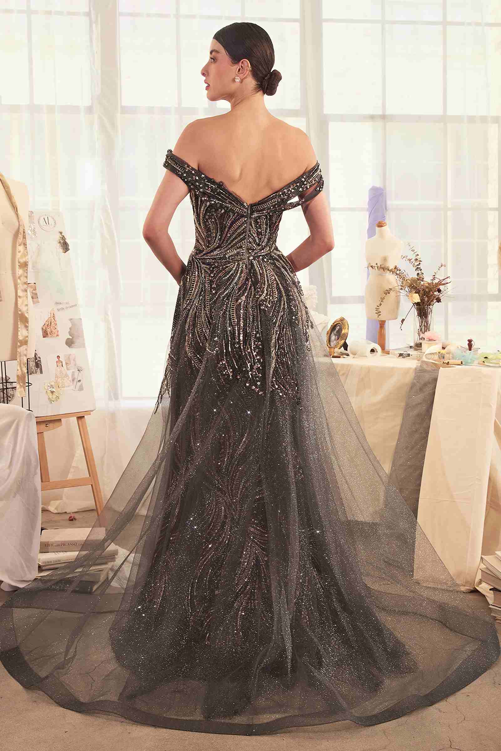 Dark silver off-shoulder beaded gown with draped overskirt, back view