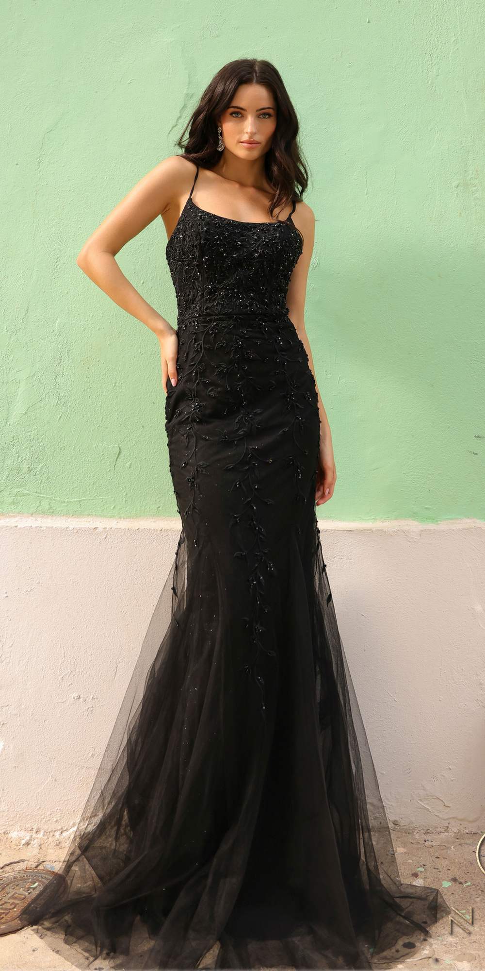 Black long fitted mermaid gown with thin spaghetti straps and glittery lace