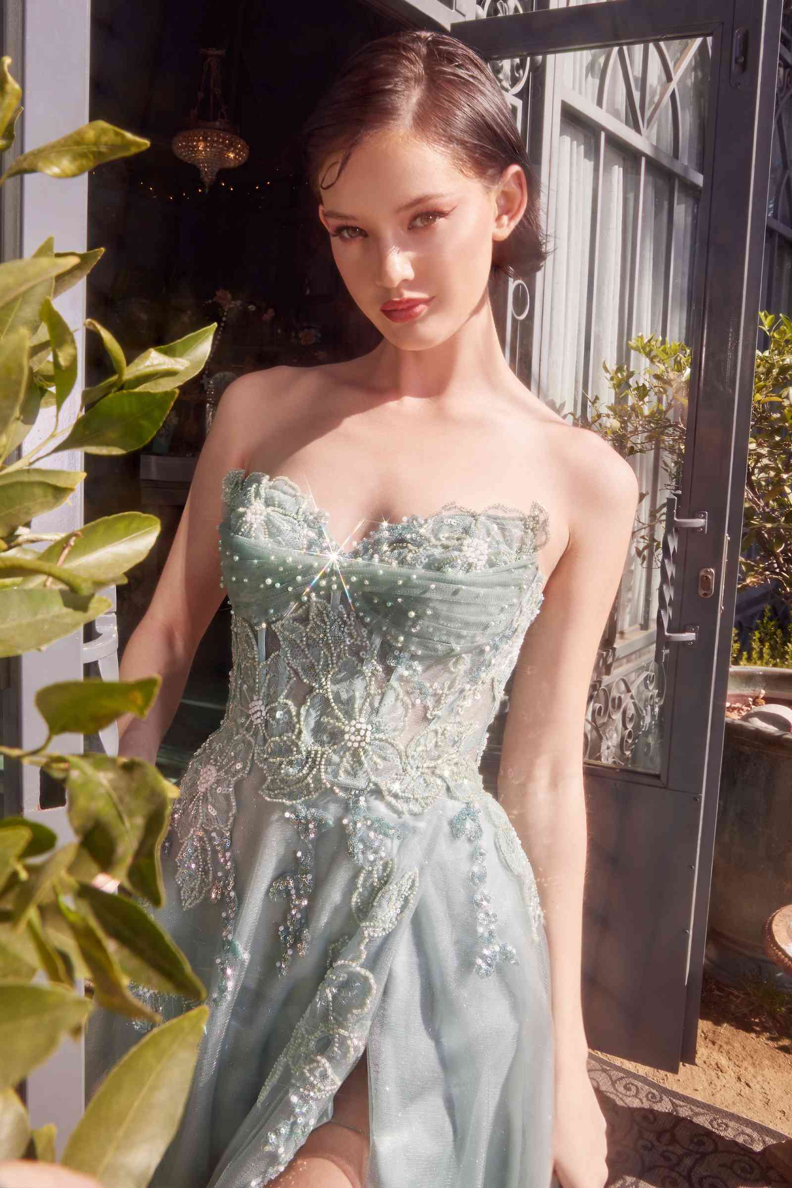 Light green strapless layered tulle ball gown with lacey beaded bodice and sweetheart neckline