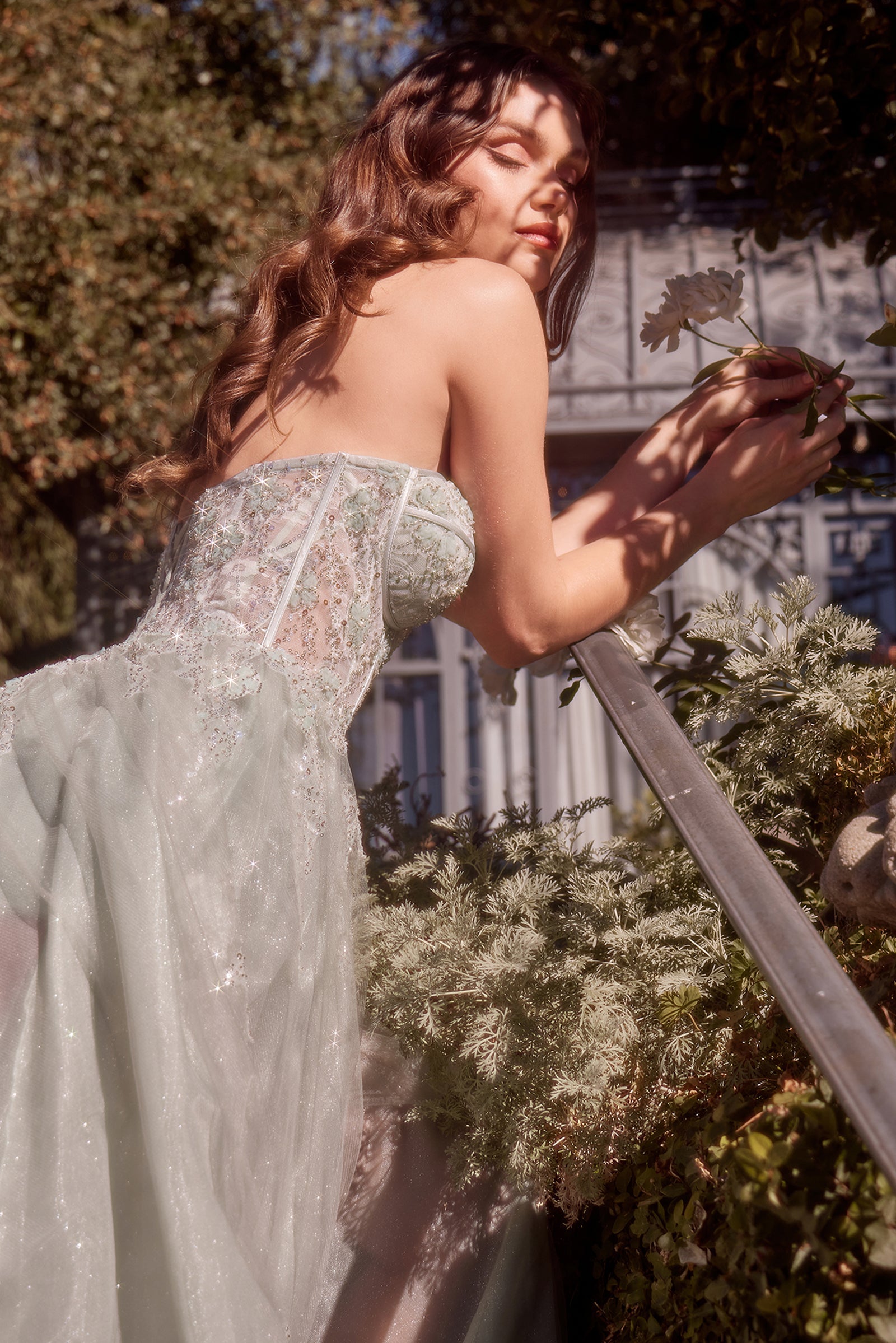 Light gray tulle A-line gown with sweetheart neckline and lace daisy appliques