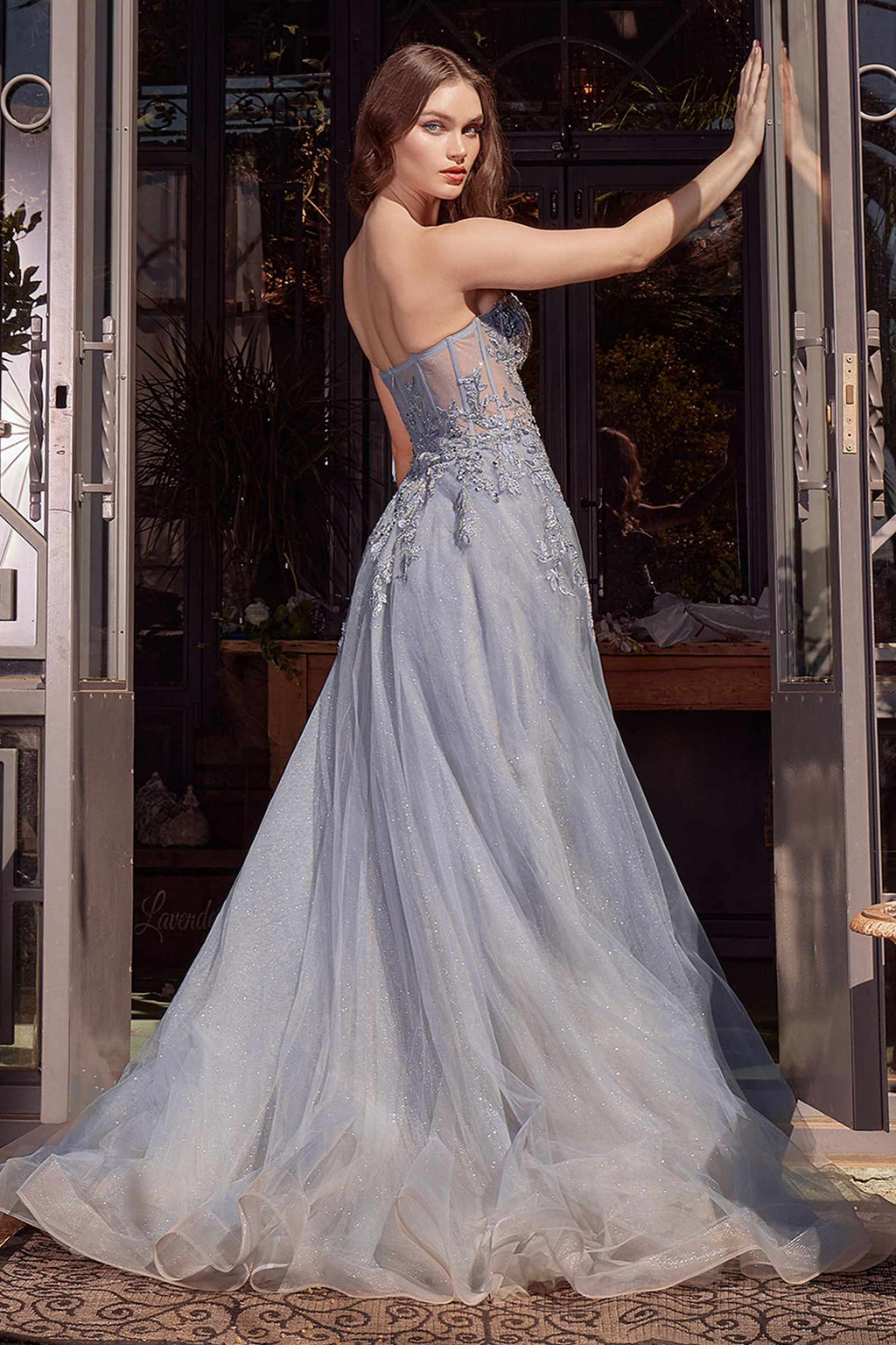 Smokey blue strapless corset ball gown with embellished bodice and flowing tulle skirt