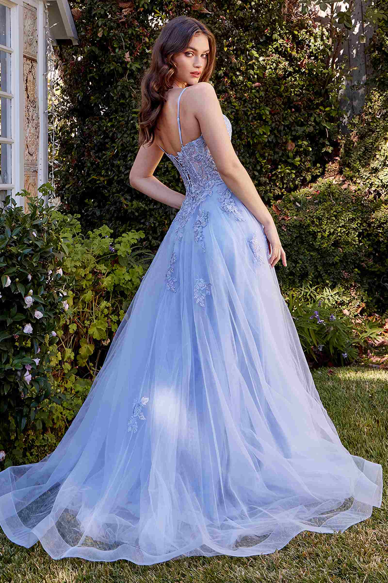Powder blue A-line tulle gown with lace appliqued straps and tiered skirt