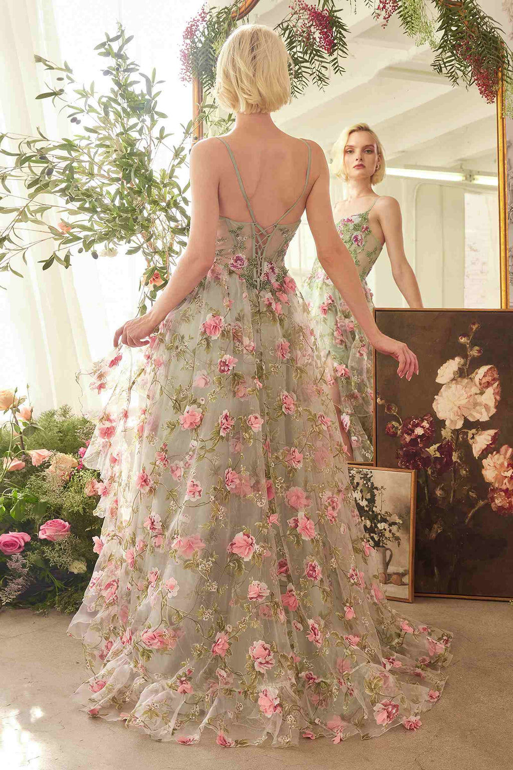 Sage floral A-line dress from back with open crisscross straps and tiered skirt