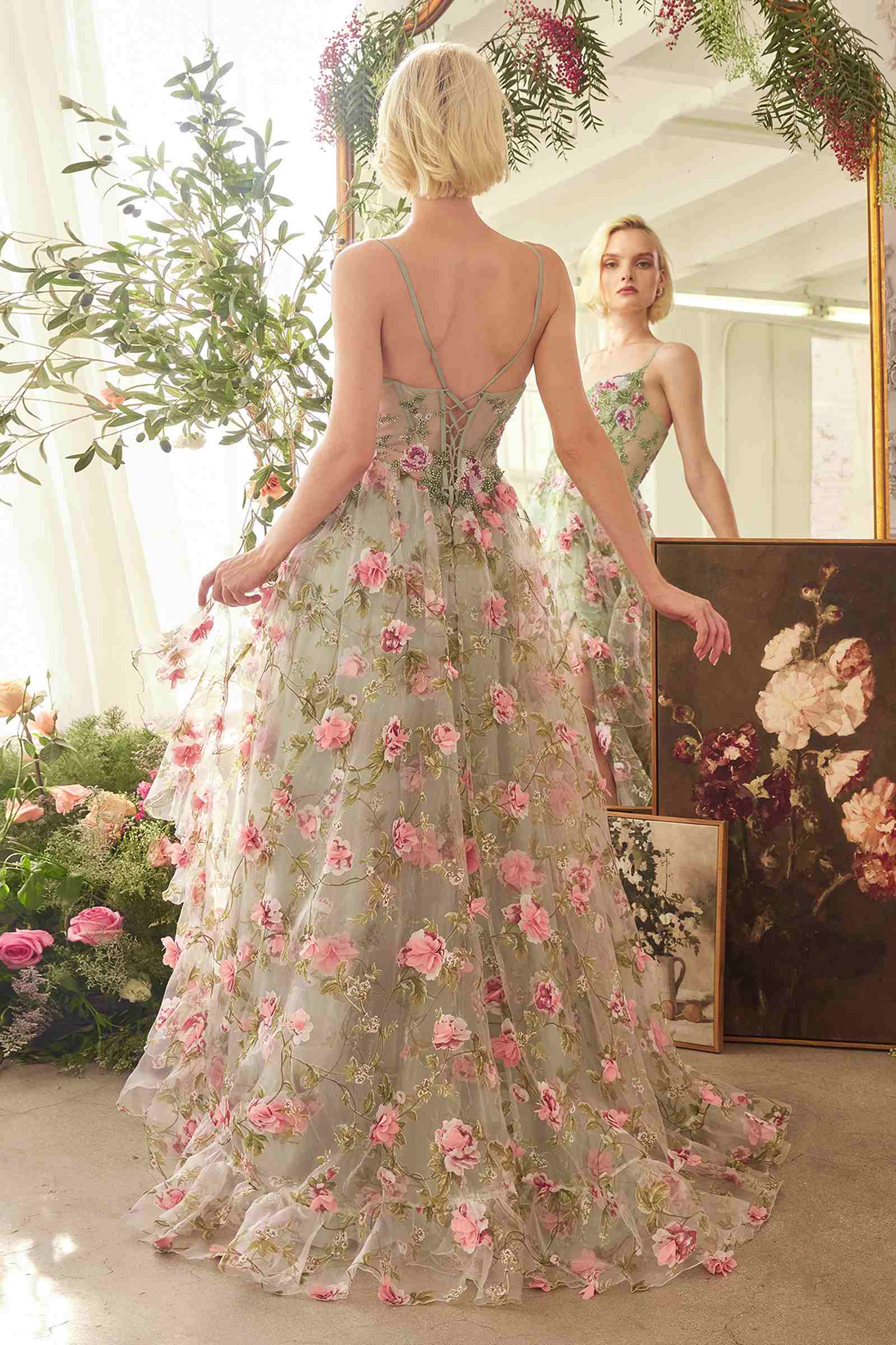 Sage floral A-line dress from back with open crisscross straps and tiered skirt
