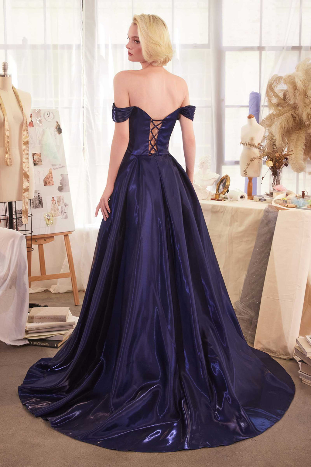 Off-shoulder organza ball gown in dark navy, corset back crisscross straps, full skirt