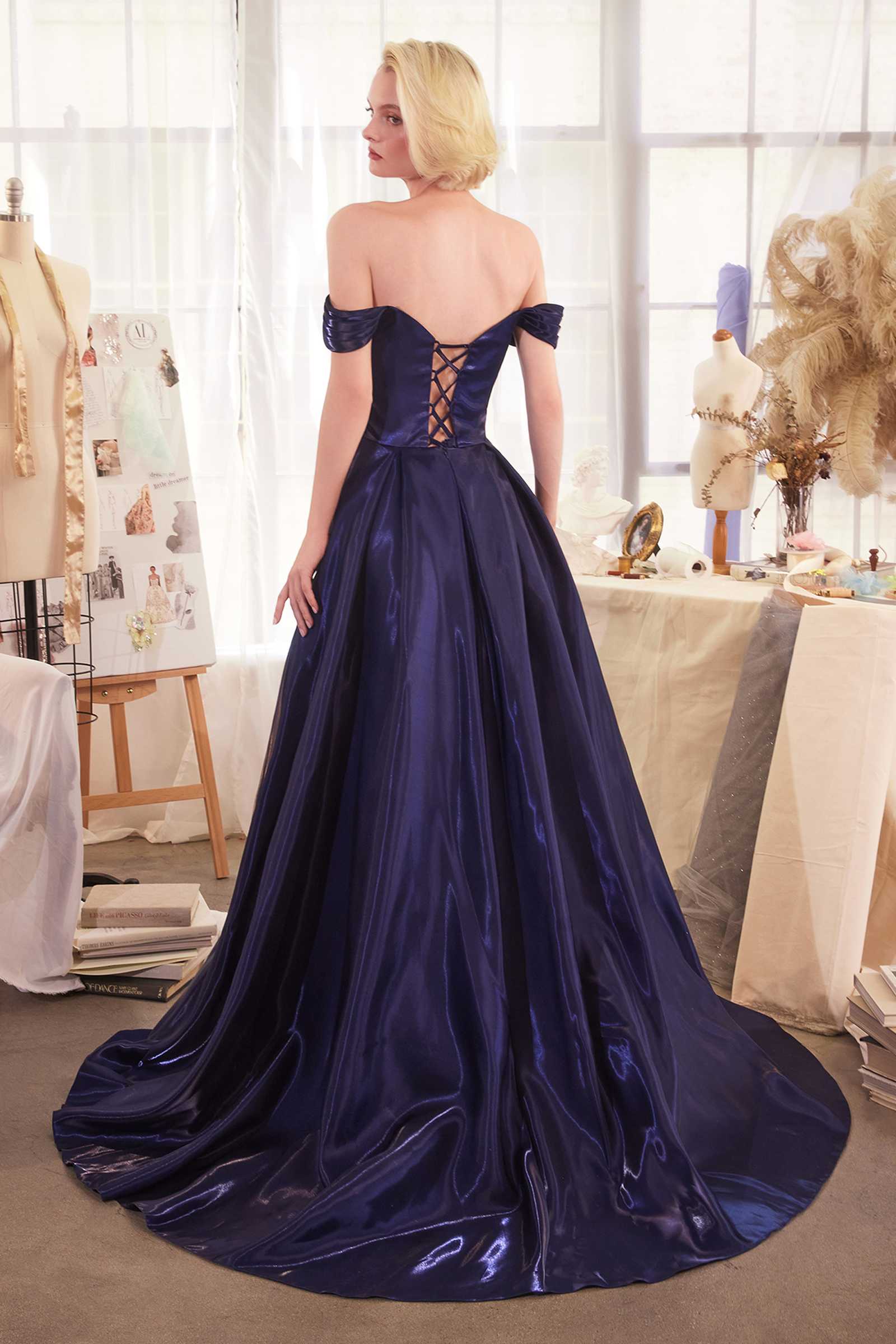 Off-shoulder organza ball gown in dark navy, corset back crisscross straps, full skirt