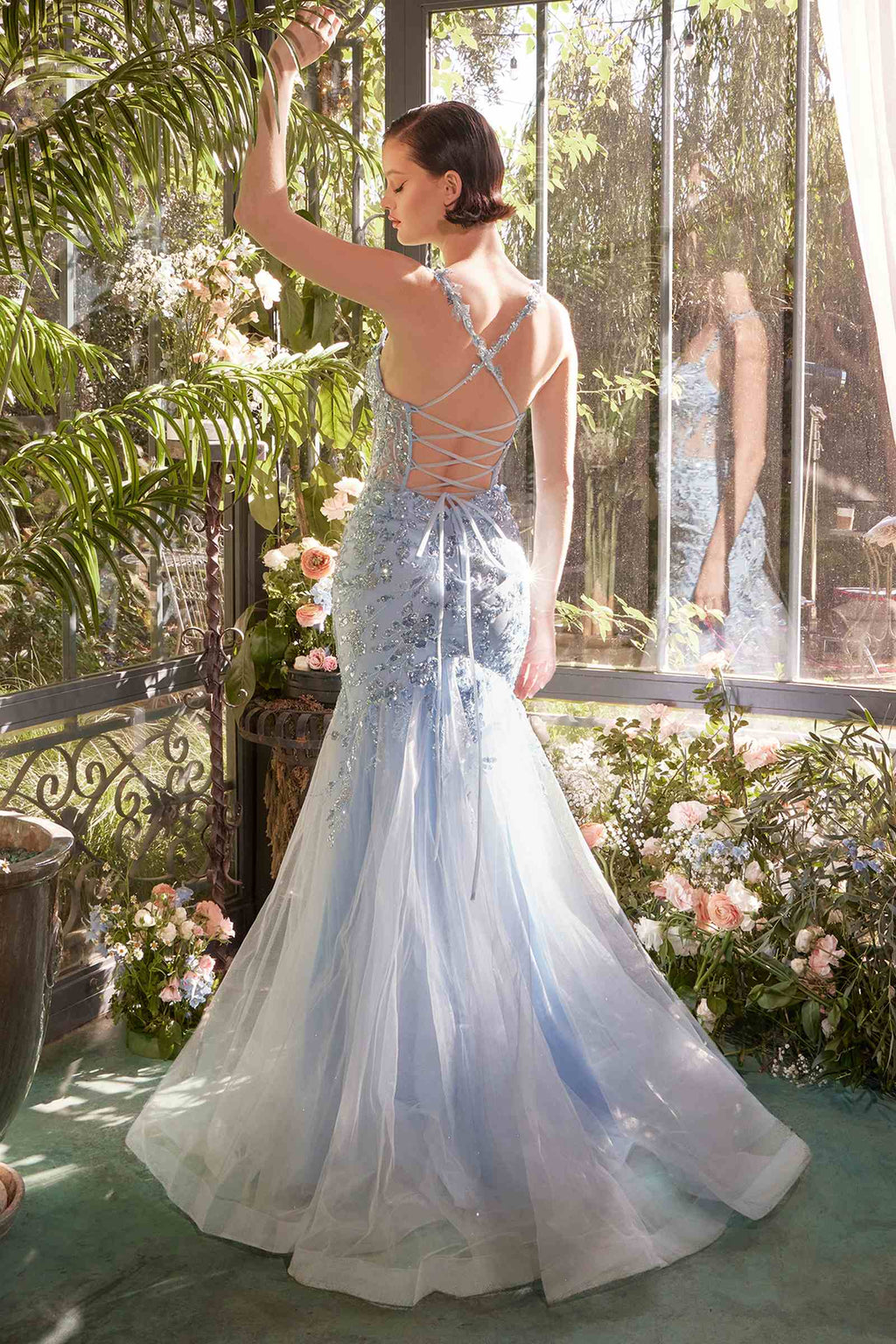 Light blue sequin mermaid gown with crisscross back straps and flared tulle skirt