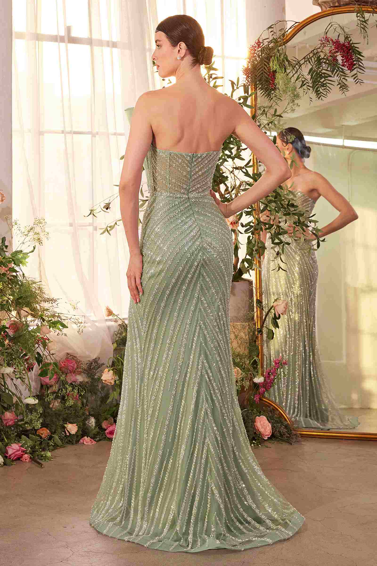 Sage green beaded gown with pleated bodice and draped back panel