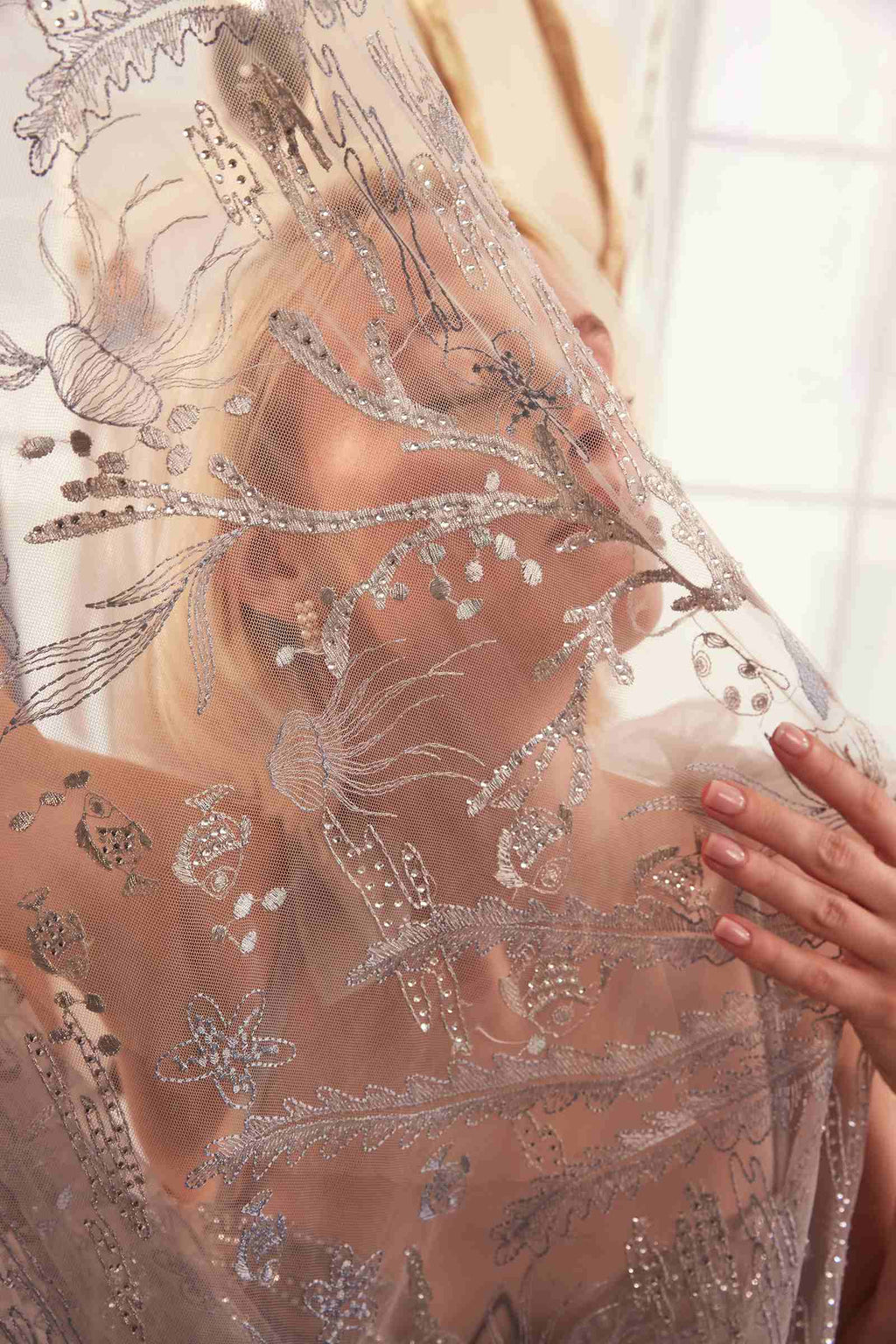 Silver sheer embroidered fabric with sparkling beaded vines and floral motifs