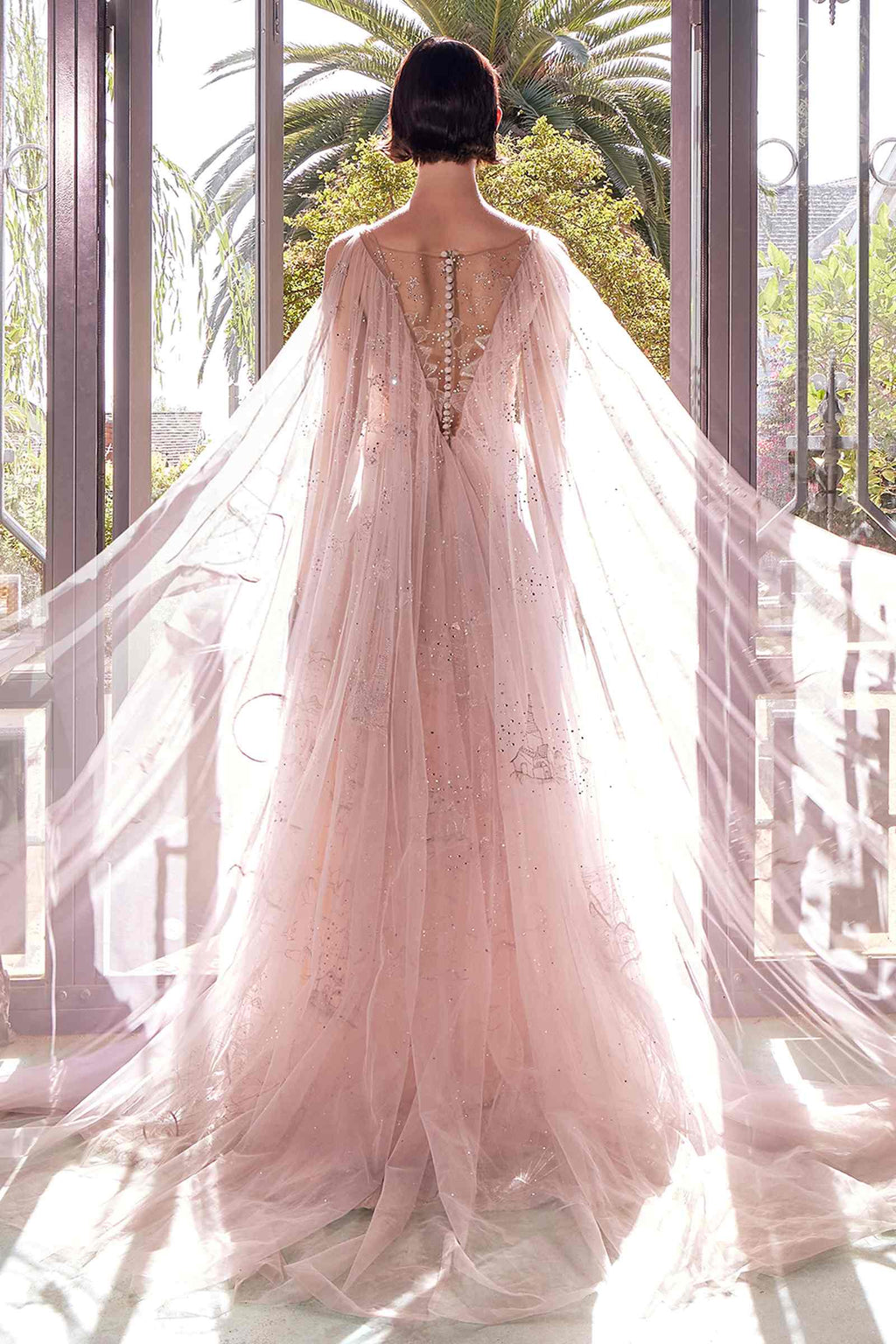 Nude embroidered tulle gown with thin straps and open back, full flowing skirt