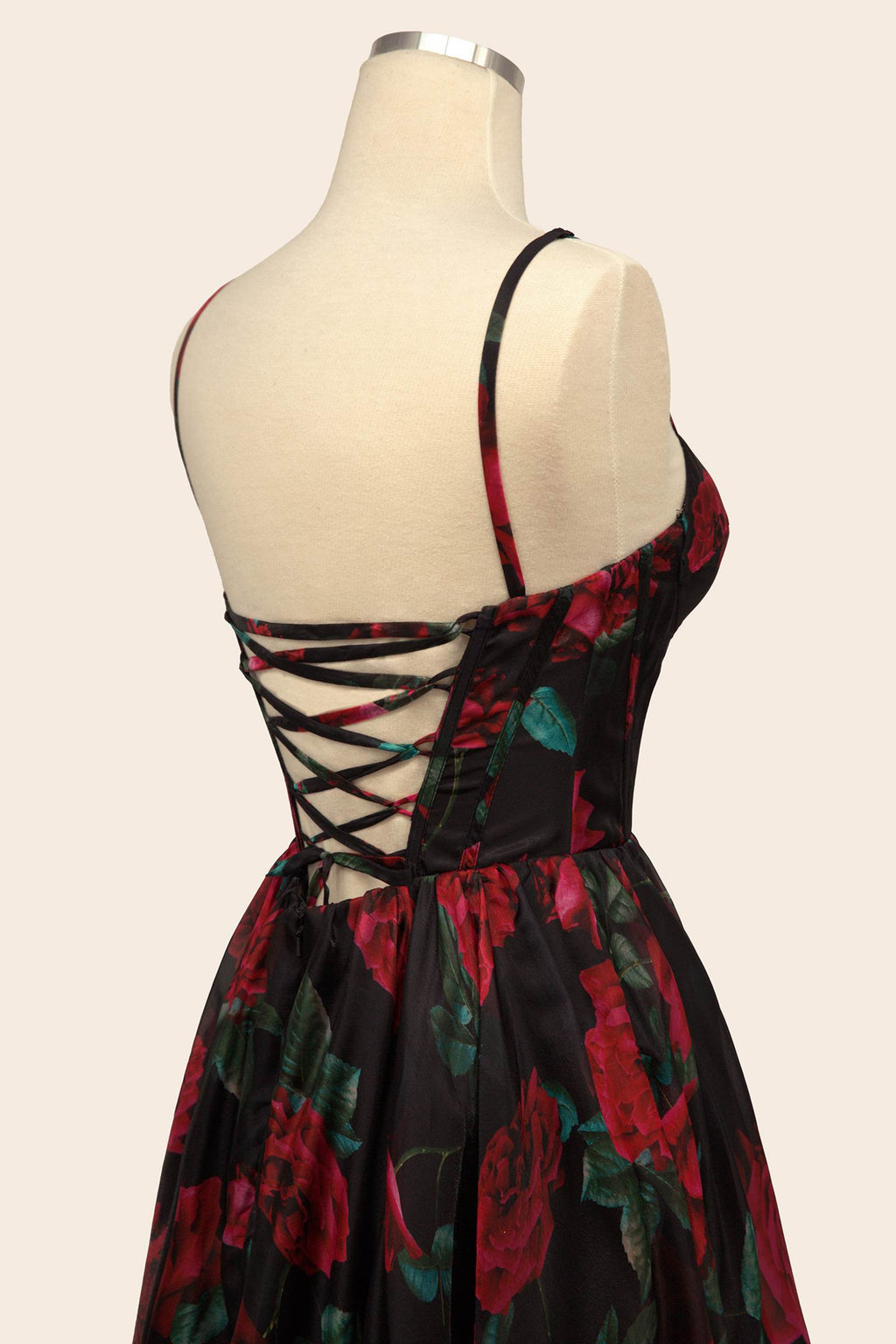 Black rose-print organza gown with crisscross lace-up back on mannequin