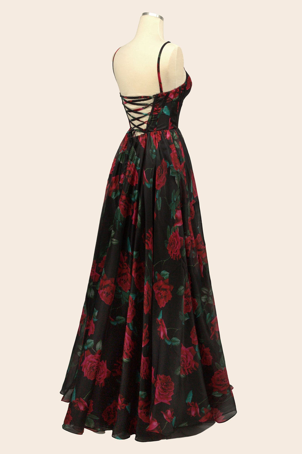 Black rose-print organza gown on mannequin, open back and corset bodice