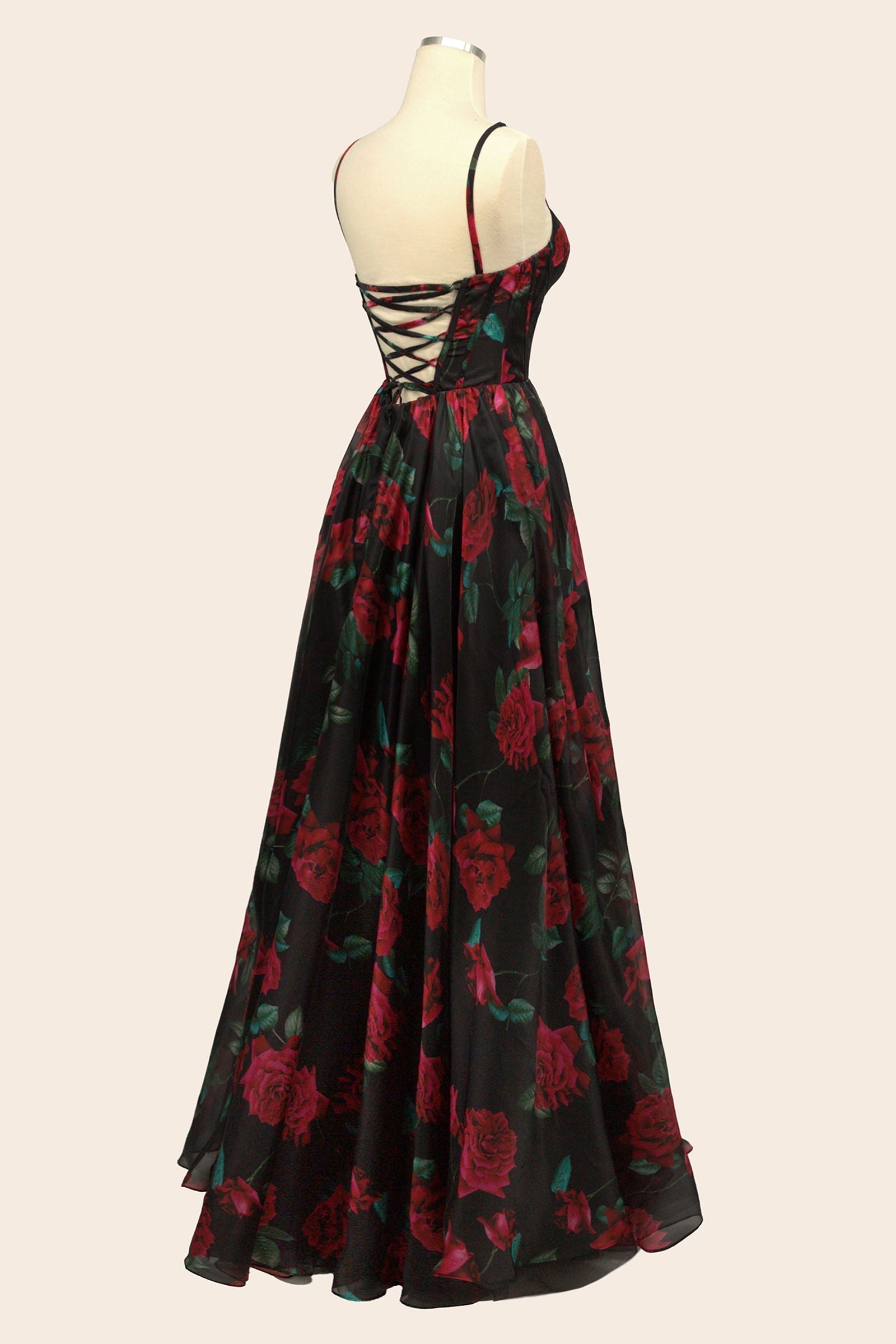 Black rose-print organza gown on mannequin, open back and corset bodice