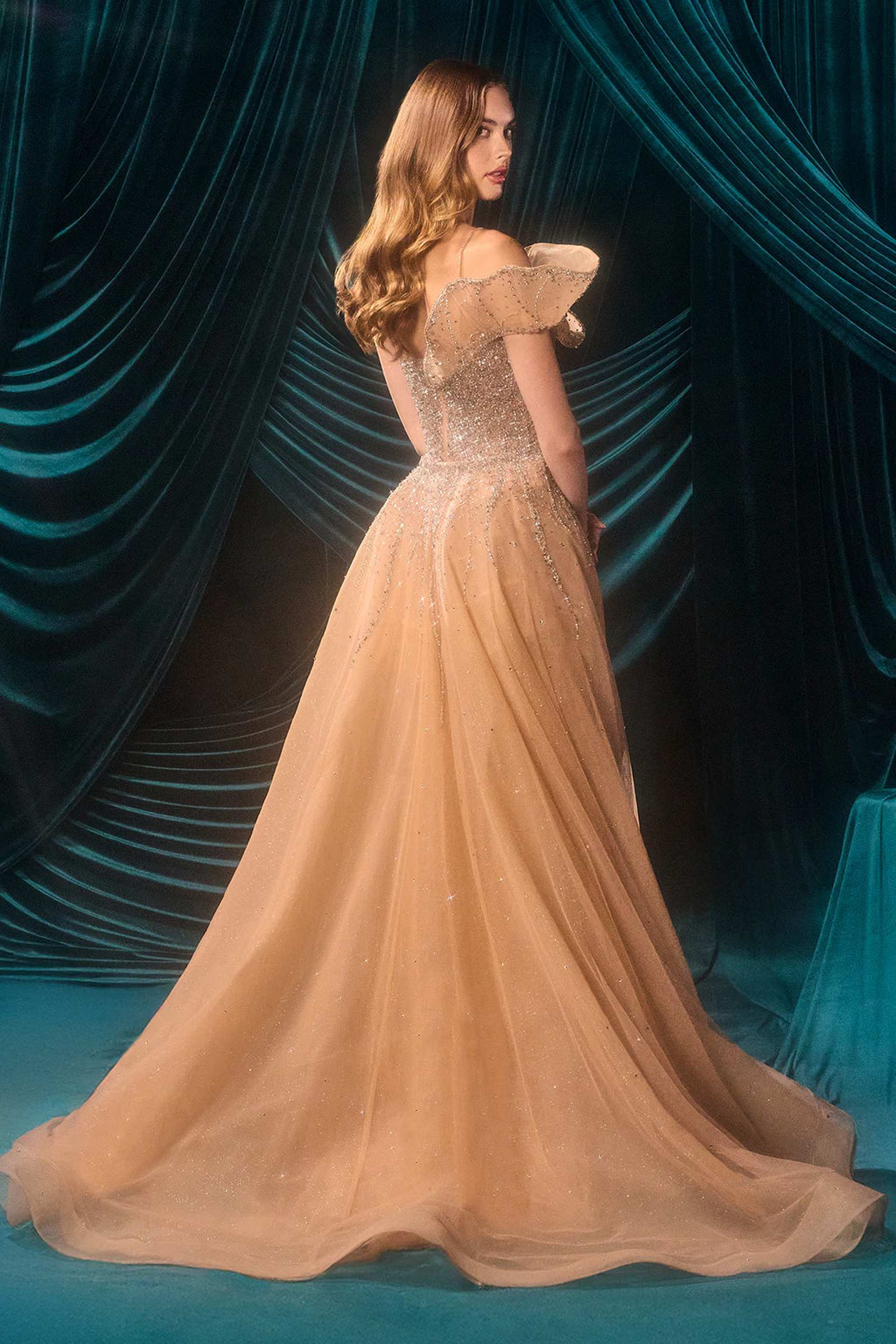 Silver sequin mermaid gown with sweetheart neckline, nude tulle back view and draped sleeves
