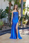 Royal blue strapless sequin prom gown with side slit and fitted satin drape