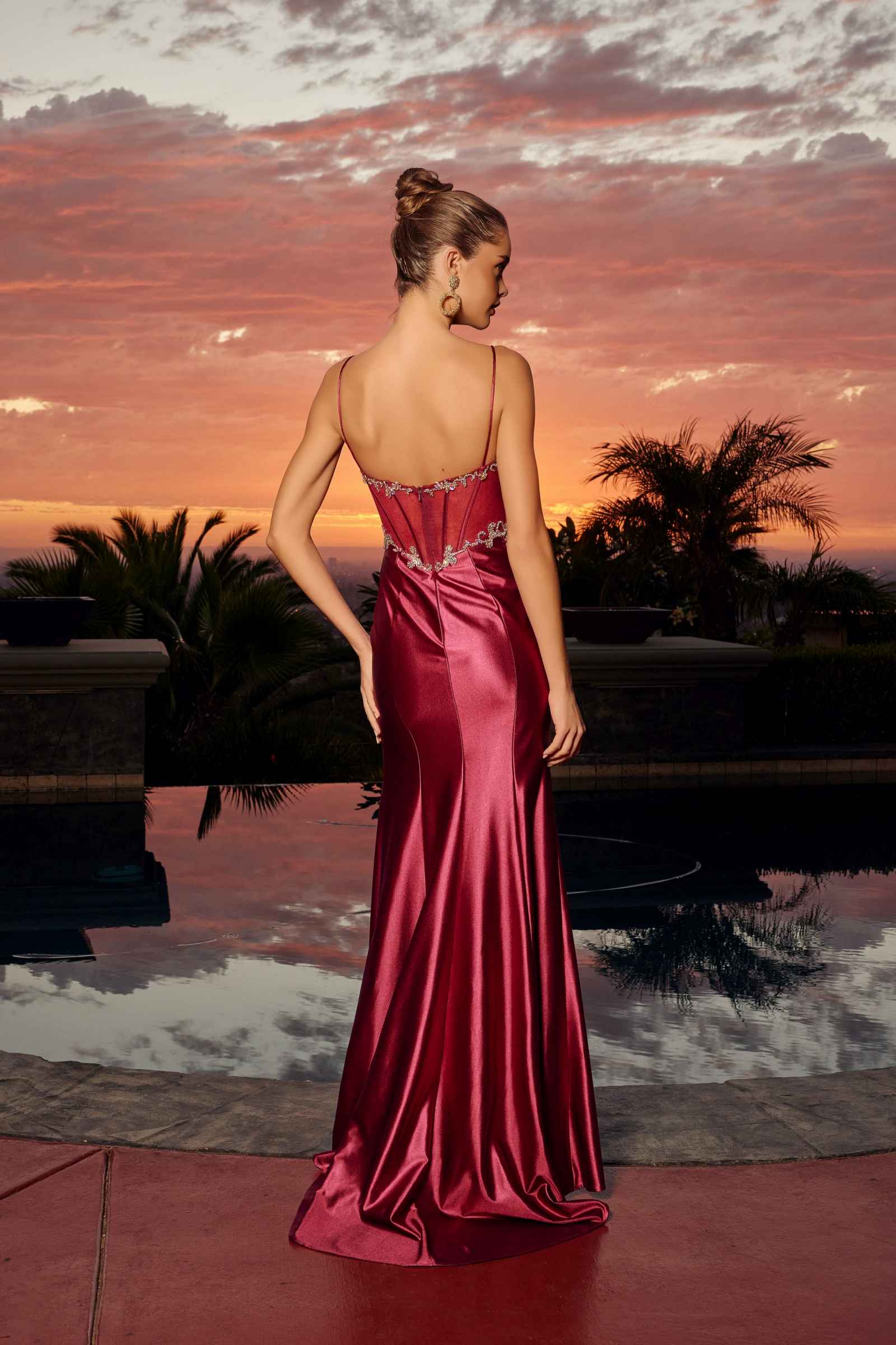 Wine fitted satin evening gown, open-back with jeweled straps and long slit