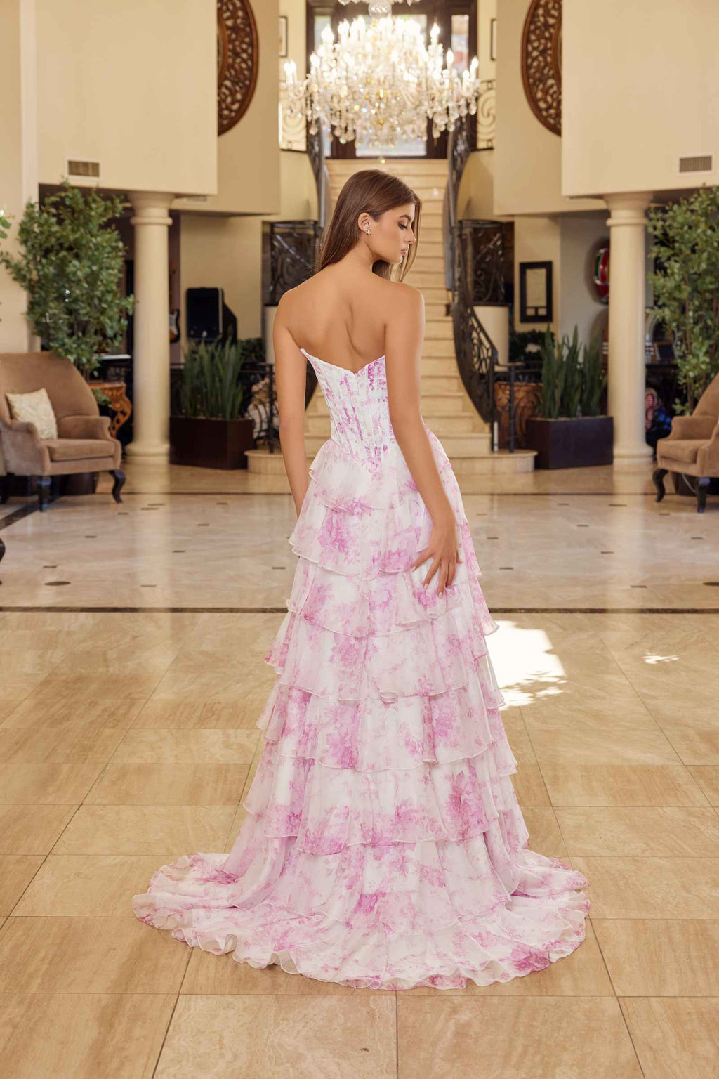 Pink printed strapless prom gown with open back and tiered ruffled chiffon skirt