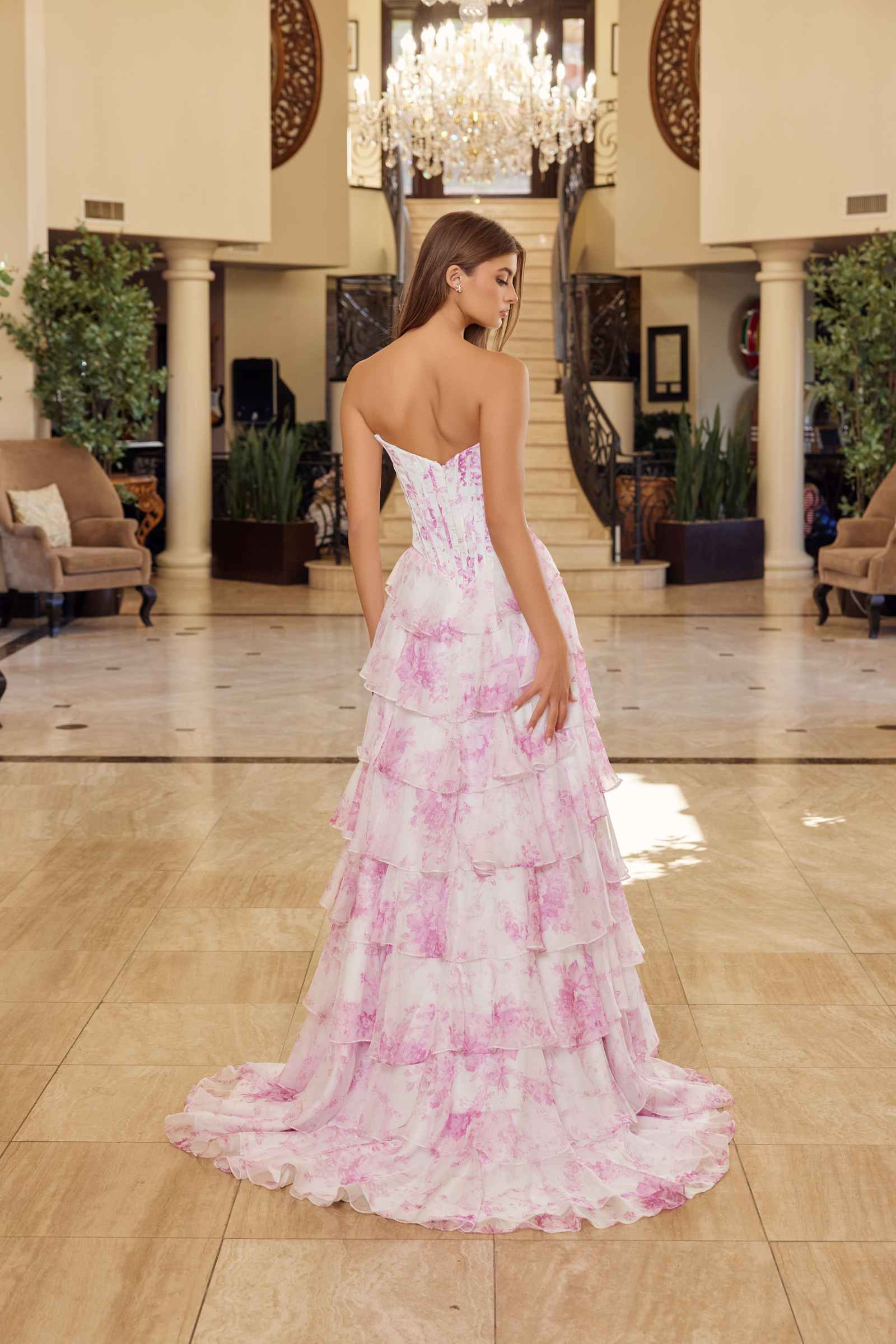Pink printed strapless prom gown with open back and tiered ruffled chiffon skirt