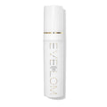 Eve Lom brightening serum bottle with white cap and gold label