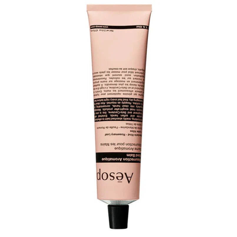 Aesop hand balm tube with pink cream-colored body and black screw-top, 75 mL