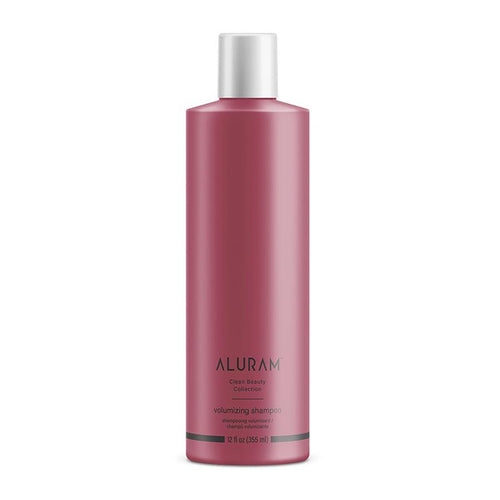 Volumizing shampoo bottle with silver cap, maroon label