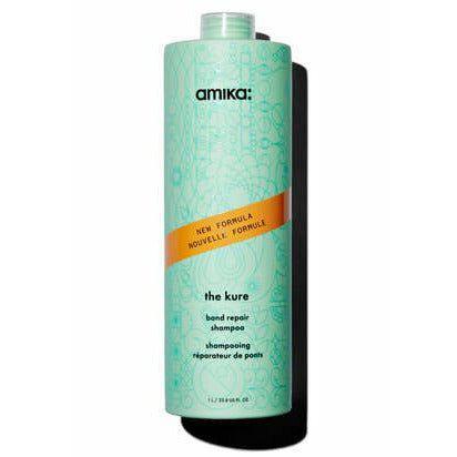 amika the kure bond repair shampoo bottle, turquoise with orange label accent