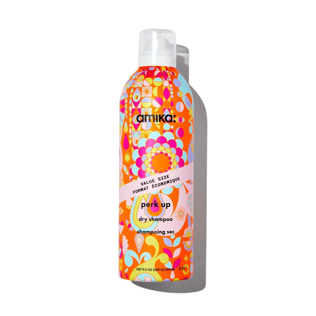 Talc-free dry shampoo bottle with colorful orange floral design and pump