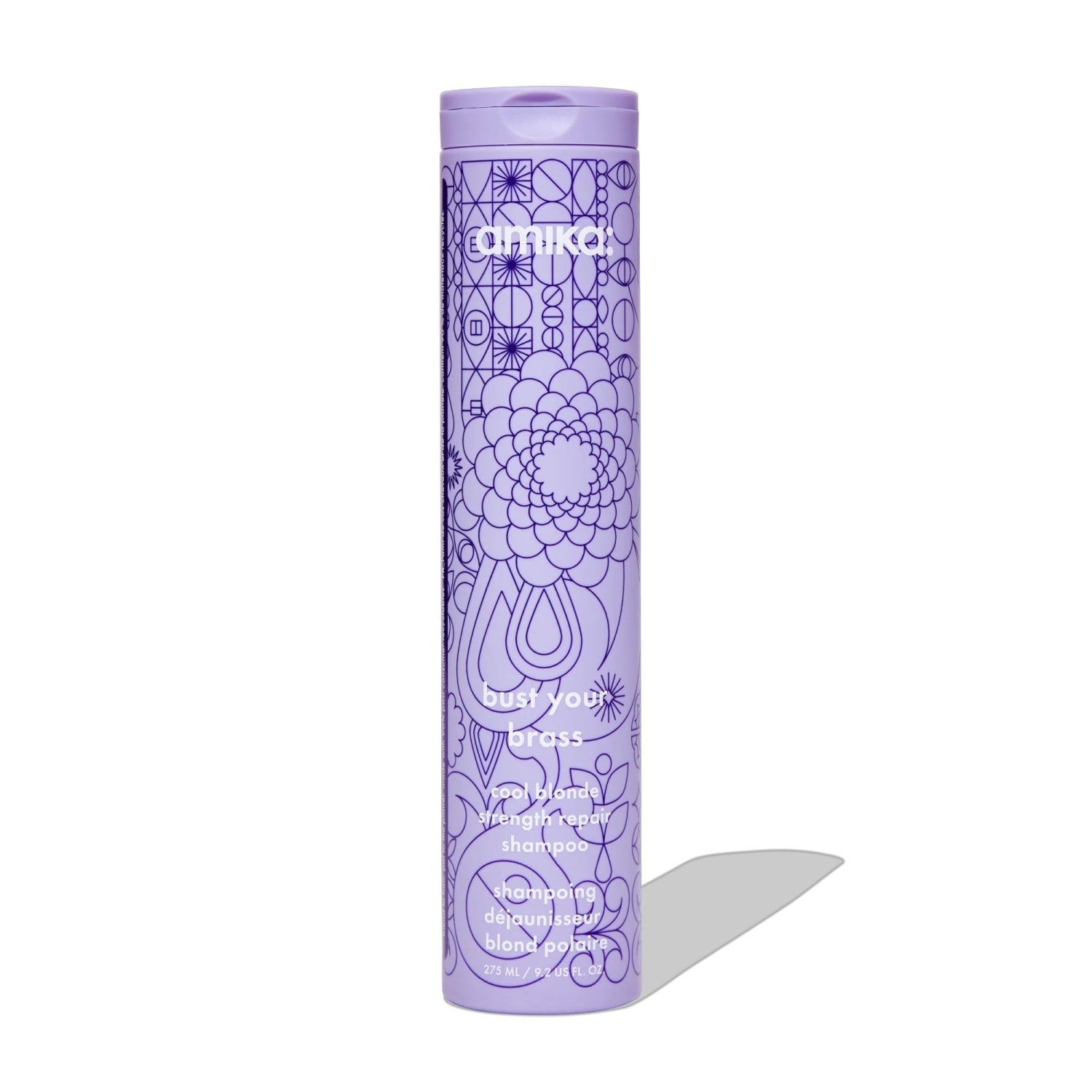 Purple shampoo bottle with cap and Amika label, side view.