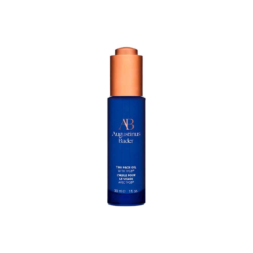 Face oil bottle with copper cap, blue label