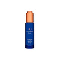 Face oil bottle with copper cap and blue label