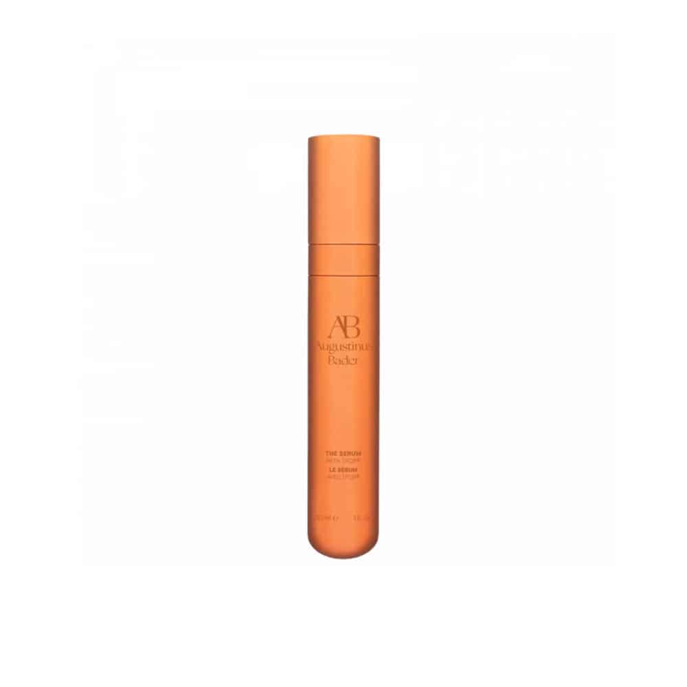 Augustinus Bader serum in tall cylindrical orange bottle with AB logo and cap