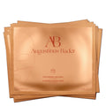 Augustinus Bader hydrogel face mask sachets, amber-gold foil packets with AB logo