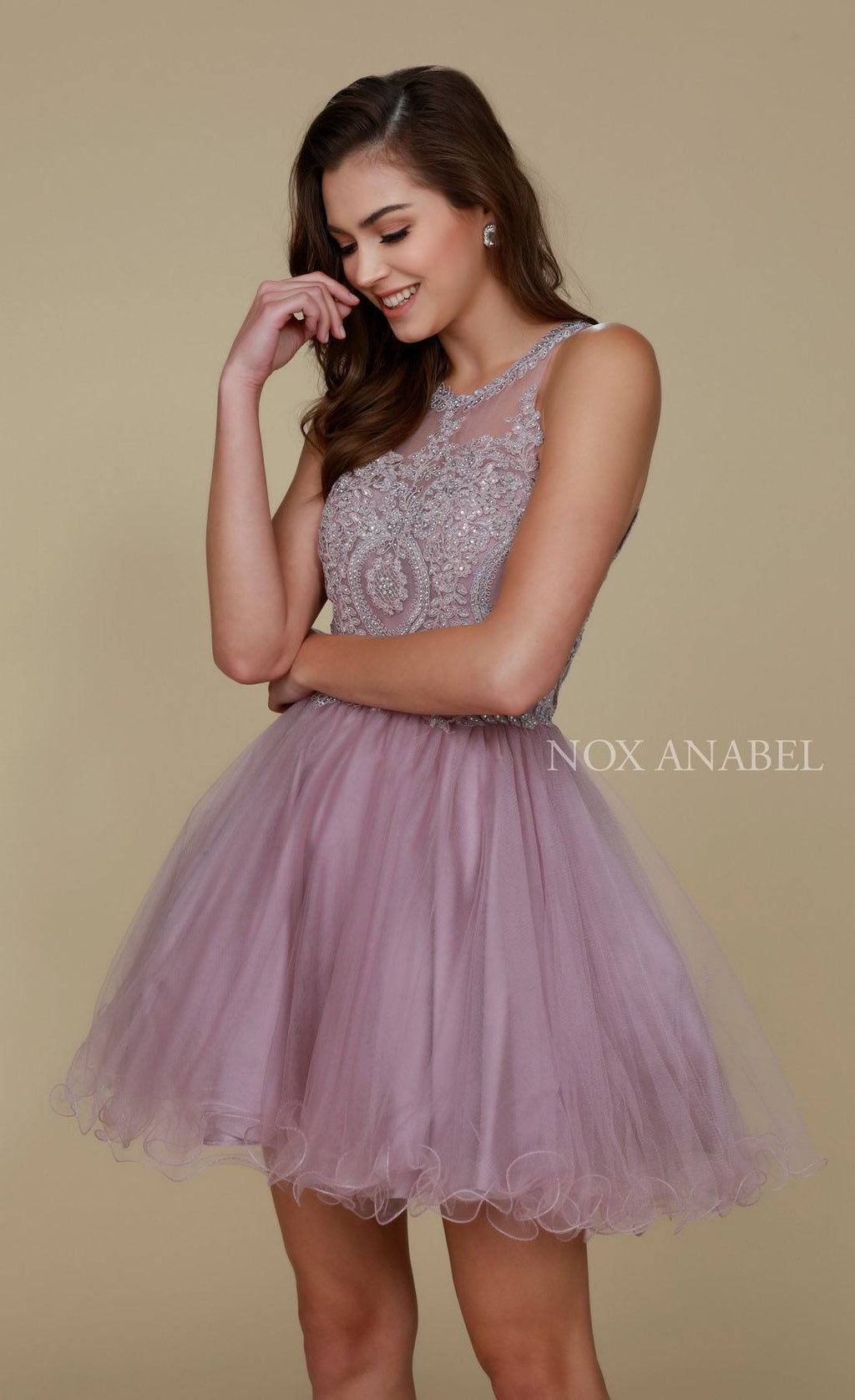 Mauve sleeveless short dress with beaded lace bodice and tulle skirt.