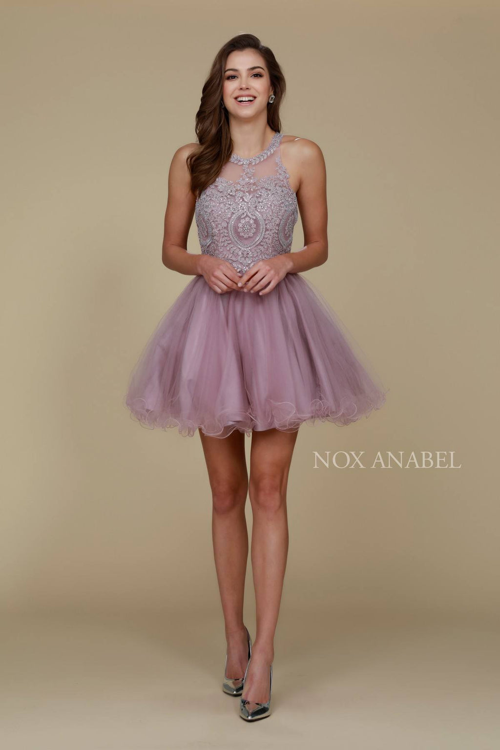 Mauve sleeveless short dress with embellished bodice and layered tulle skirt.