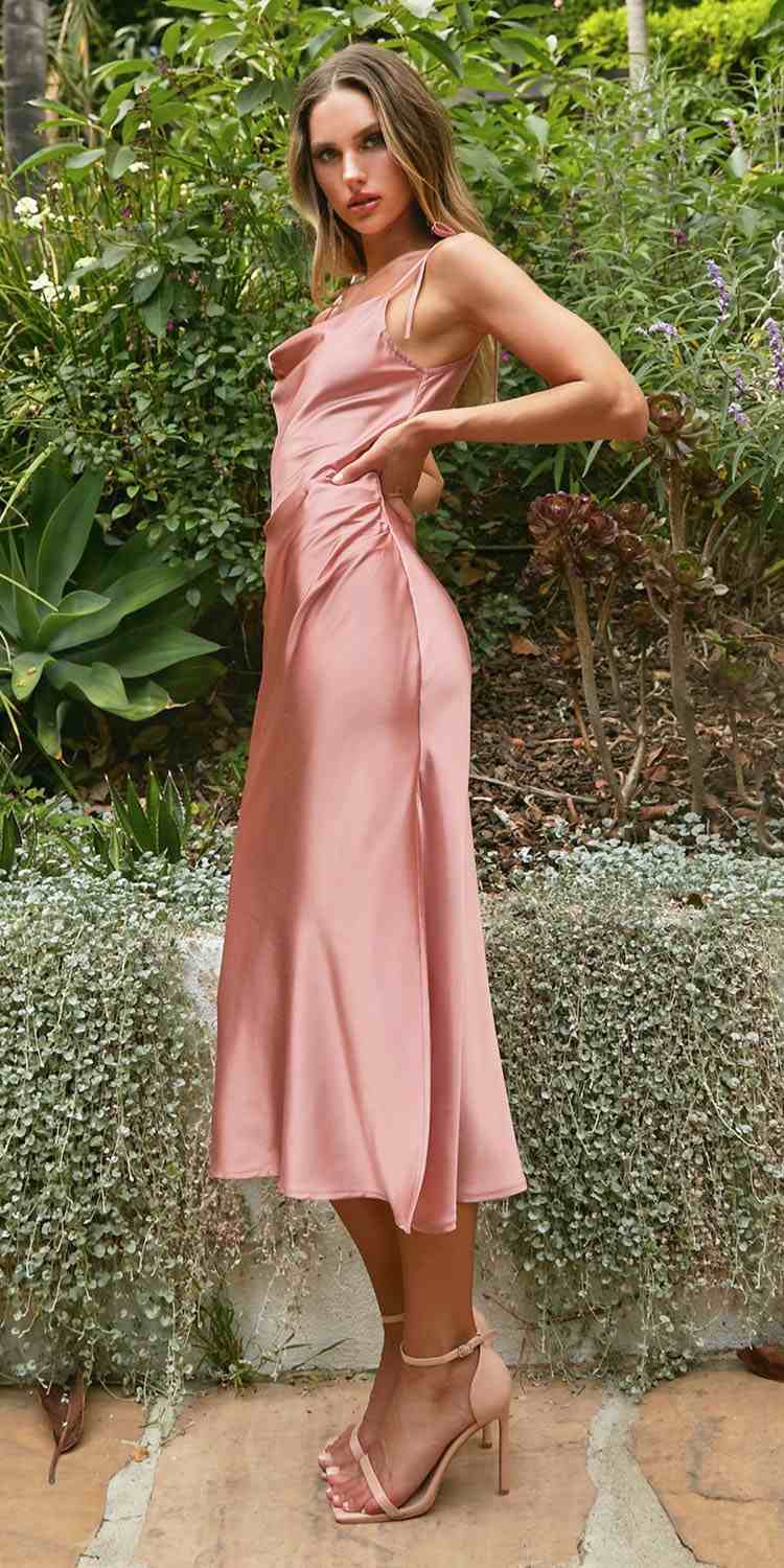 Blush pink satin midi slip dress with spaghetti straps and draped bodice