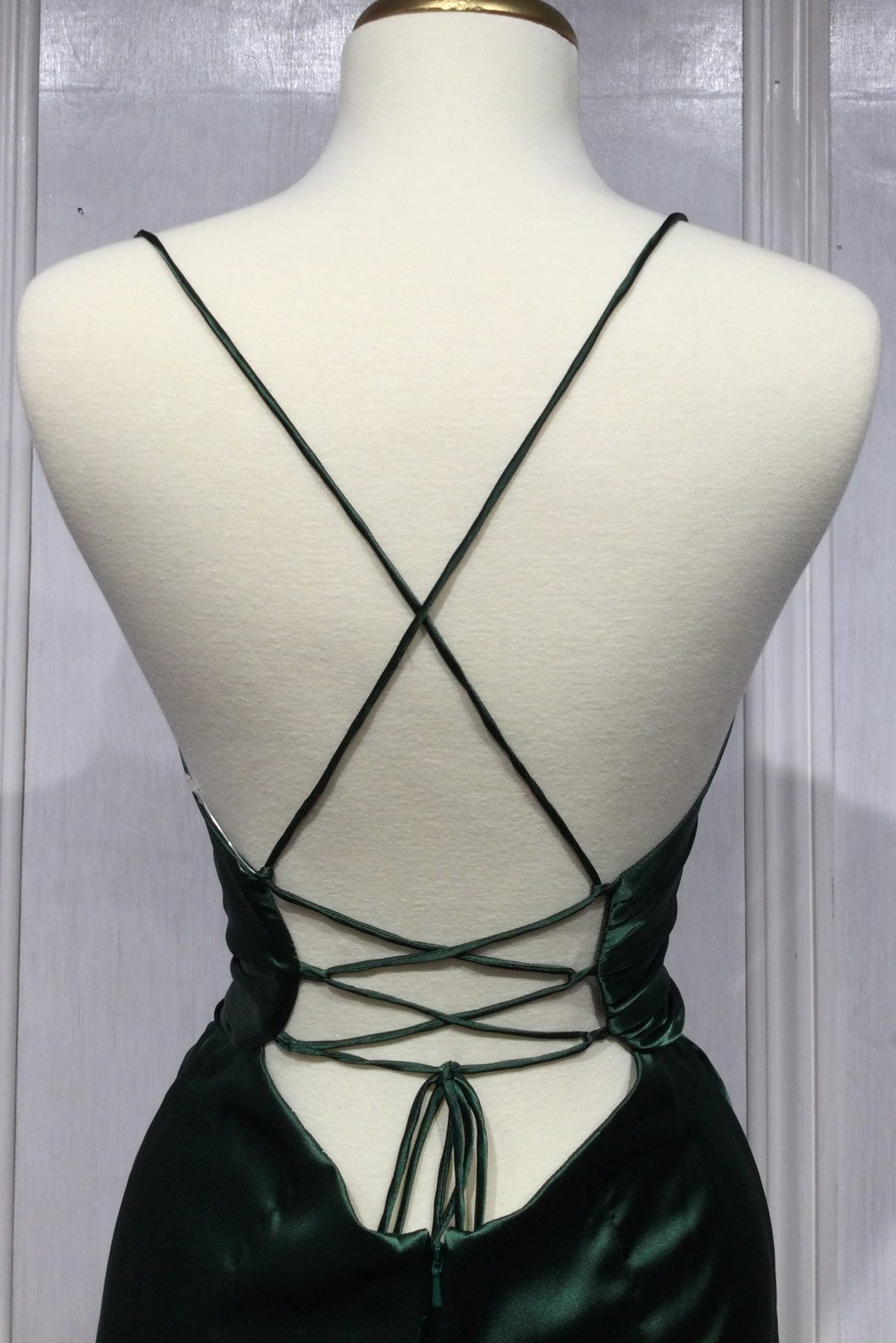 Black satin fitted knot gown with crisscross back straps and tied back detail