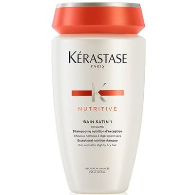 Kérastase Paris Bain Satin 1 shampoo bottle, white with orange cap and label
