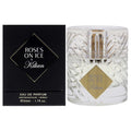 Eau de parfum bottle with clear glass, gold accents, and Roses on Ice label