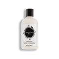 Beekman 1802 honeyed grapefruit conditioner bottle with black cap, cream label