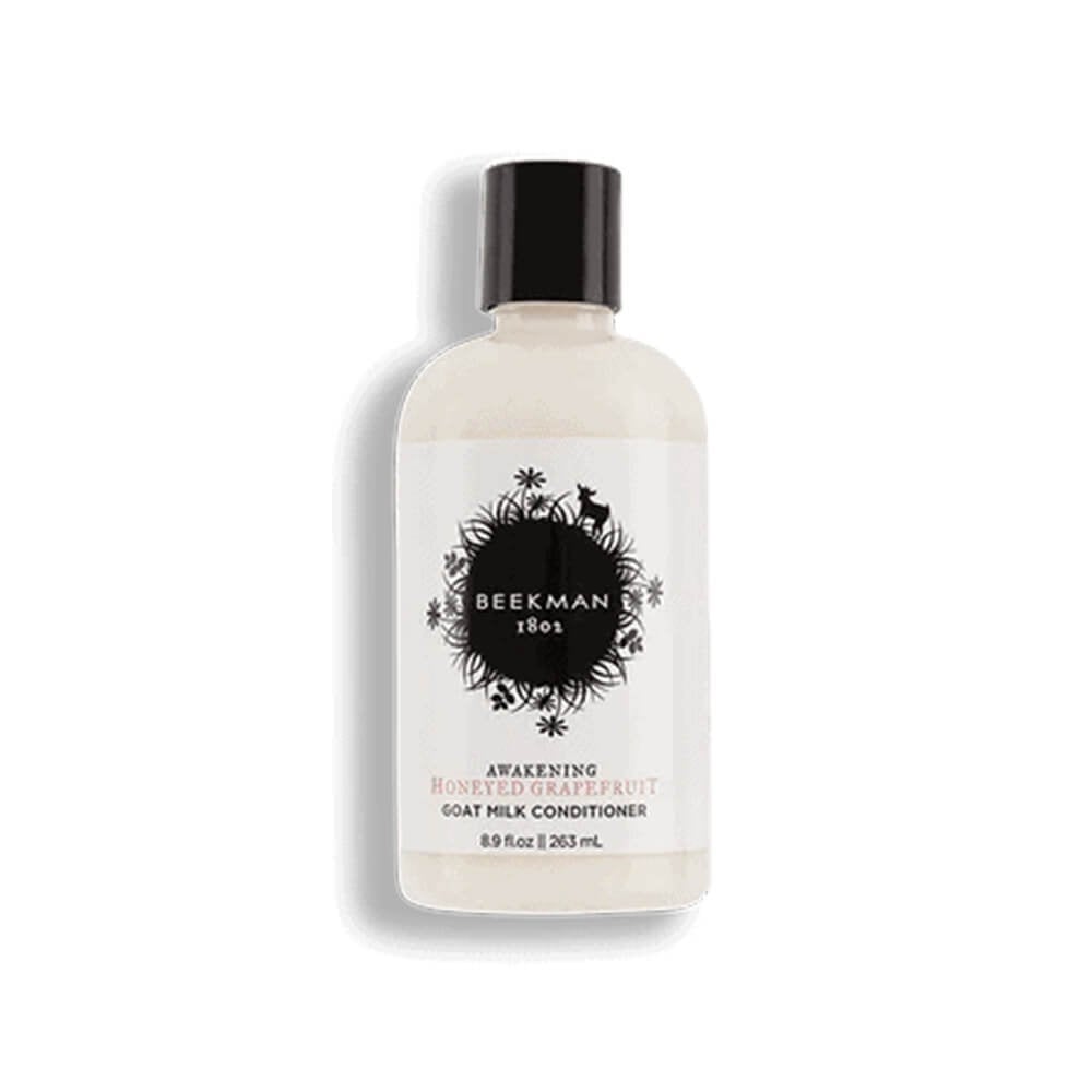 Beekman 1802 honeyed grapefruit conditioner bottle with black cap, cream label