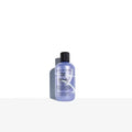 Blonde shampoo bottle with black pump cap, light purple label by Bumble and bumble.