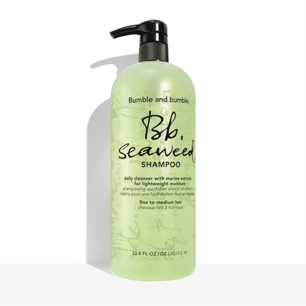 Seaweed shampoo bottle with black pump, translucent pale green liquid
