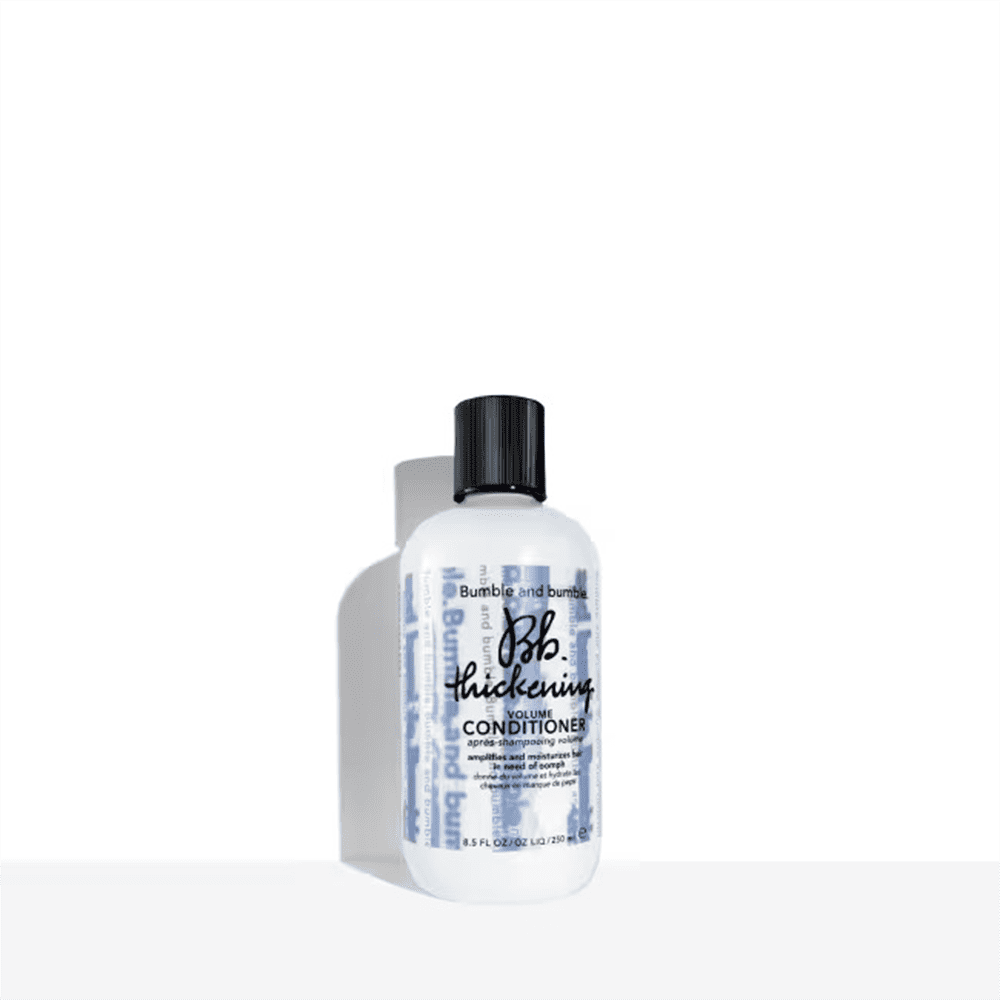 Bumble and bumble thickening volume conditioner bottle, white with black cap.