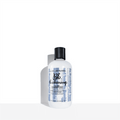 Bumble and bumble Thickening Volume Shampoo bottle with black cap, white bottle